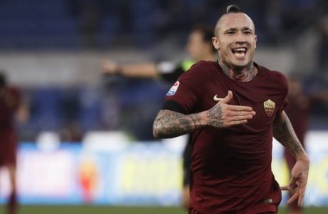 Roma's Radia Nainggolan celebrates after scoring his side's second goal during a Serie A soccer match between Lazio and Roma, at the Rome Olympic stadium Sunday, Dec. 4, 2016. (AP Photo/Gregorio Borgia)