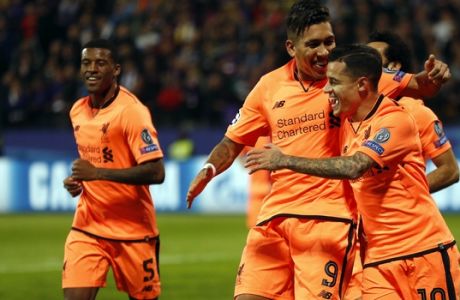 Liverpool's Philippe Coutinho, right, celebrates with his teammates after scoring during the Champions League soccer match between Maribor and Liverpool at the Ljudski vrt stadium, in Maribor, Slovenia, Tuesday, Oct. 17, 2017. (AP Photo/Darko Bandic)