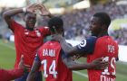 Lille's forward Nicolas Pepe, right, celebrates with teammate Jonathan Bamba after scoring his side third goal against Nantes, during a French League One soccer match between Nantes and Lille at La Beaujoire Stadium in Nantes, western France, Sunday, March 31, 2019. Lille won 3-2. (AP Photo/David Vincent)