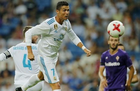 Real Madrid's Cristiano Ronaldo heads the ball on goal during the Santiago Bernabeu Trophy soccer match between Real Madrid and Fiorentina at the Santiago Bernabeu stadium in Madrid, Spain, Wednesday, Aug. 23, 2017. (AP Photo/Paul White)