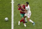 Morocco's Mehdi Benatia, left, and Iran's Vahid Amiri, right, challenge for the ball during the group B match between Morocco and Iran at the 2018 soccer World Cup in the St. Petersburg Stadium in St. Petersburg, Russia, Friday, June 15, 2018. (AP Photo/Darko Vojinovic)