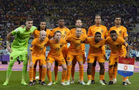 Netherlands players pose for a team photo prior the World Cup group A soccer match between Netherlands and Ecuador, at the Khalifa International Stadium in Doha, Qatar, Friday, Nov. 25, 2022. (AP Photo/Martin Meissner)