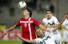 Serbia's Marko Pantelic, left, is challenged by Slovenia's Marko Suler during their group C Euro 2012 qualifying soccer match in Maribor, Slovenia, Tuesday, Oct. 11, 2011. (AP Photo/Darko Bandic)