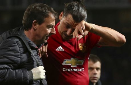 Manchester United's Zlatan Ibrahimovic leaves the field with an injury during the Europa League quarterfinal second leg soccer match between Manchester United and Anderlecht at Old Trafford stadium, in Manchester, England, Thursday, April 20, 2017. (AP Photo/Dave Thompson)
