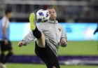 D.C. United forward Wayne Rooney warms up before the team's MLS soccer match against the New York Red Bulls, Wednesday, July 25, 2018, in Washington. (AP Photo/Nick Wass)
