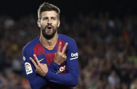 Barcelona's Gerard Pique celebrates after scoring his side's third goal during the Spanish La Liga soccer match between FC Barcelona and Valencia CF at the Camp Nou stadium in Barcelona, Spain, Saturday, Sep. 14, 2019. (AP Photo/Joan Monfort)