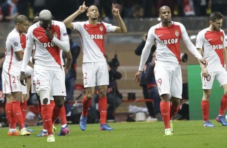Monaco's Fabinho, center, reacts as he celebrates his side's 2nd goal during a Champions League round of 16 second leg soccer match between Monaco and Manchester City at the Louis II stadium in Monaco, Wednesday March 15, 2017. (AP Photo/Claude Paris)