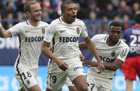 Monaco's Kylian Mbappe, center, celebrates with teammates after he scored the first goal during their French League One soccer match against Caen, in Caen, north western France, Sunday, March 19, 2017. (AP Photo/David Vincent)