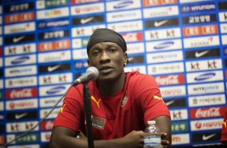 Asamoah Gyan, the captain of the Ghana National Soccer team, talks to the media, Sunday, June 8, 2014 in Miami Gardens, as his team prepares for the upcoming match against South Korea. (AP Photo/J Pat Carter)