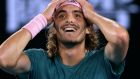 Greece's Stefanos Tsitsipas celebrates after defeating Switzerland's Roger Federer in their fourth round match at the Australian Open tennis championships in Melbourne, Australia, Sunday, Jan. 20, 2019. (AP Photo/Mark Schiefelbein)