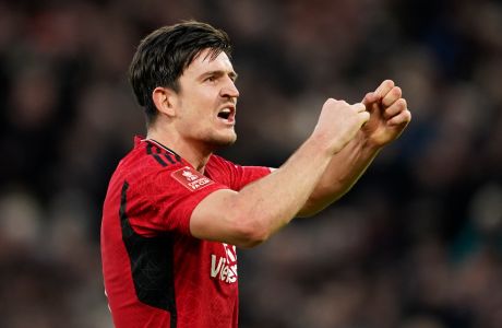 Manchester United's Harry Maguire celebrates at full time of the FA Cup quarterfinal soccer match between Manchester United and Liverpool at the Old Trafford stadium in Manchester, England, Sunday, March 17, 2024. Manchester United won 4-3. (AP Photo/Dave Thompson)