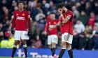 Manchester United players react after losing the English Premier League soccer match between Manchester United and Fulham at Old Trafford stadium in Manchester, Saturday, Feb. 24, 2024.(AP Photo/Dave Thompson)