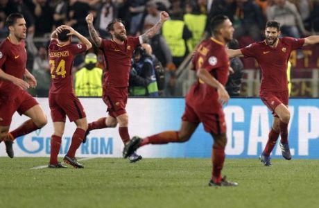 Roma players celebrate after Kostas Manolas scored his side's 3rd goal during the Champions League quarterfinal second leg soccer match between Roma and FC Barcelona at Rome's Olympic Stadium, Tuesday, April 10, 2018. (AP Photo/Andrew Medichini)