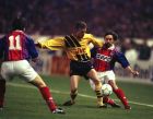 Arsenals John Jensen, left, and Paris St. Germains Patrick Colleter fight for the ball during their European Cup Winners Cup semi-final first leg match in Paris, March 29, 1994. (AP Photo/Lionel Cironneau)