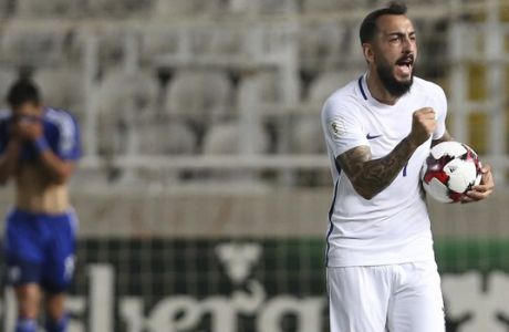 Greece's Kostas Mitroglou celebrates his goal against Cyprus during the World Cup Group H qualifying soccer match between Cyprus and Greece at GSP stadium in Nicosia, Cyprus, Saturday, Oct. 7, 2017. (AP Photo/Petros Karadjias)