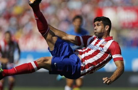 FILE - In this Sept. 14, 2013 file photo, Atletico de Madrid's Diego Costa tries an overhead kick on goal during a Spanish La Liga soccer match against Almeria at the Vicente Calderon stadium in Madrid, Spain. Atletico Madrid and Chelsea said on Thursday Sept. 21, 2017 that they have reached an agreement for the transfer of striker Diego Costa to the Spanish club who will undergo a medical and finalize the contract details with his former club. (AP Photo/Paul White, File)