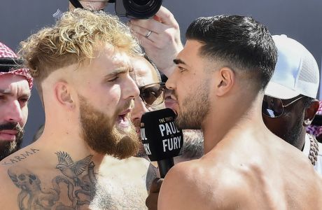 Jake Paul, left, and Tommy Fury, face off after a weigh-in, a day before their match, in Riyadh, Saudi Arabia, Saturday, Feb. 25, 2023. (AP Photo)