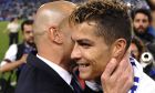 Real Madrid's Cristiano Ronaldo celebrates with Real Madrid's head coach Zinedine Zidane after winning a Spanish La Liga soccer match between Malaga and Real Madrid in Malaga, Spain, Sunday, May 21, 2017. Real Madrid wins the Spanish league for the first time in five years, avoiding its biggest title drought since the 1980s. (AP Photo/Daniel Tejedor)
