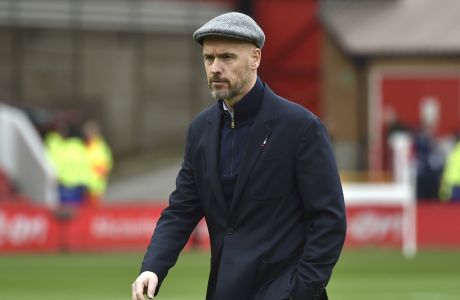 Manchester United's head coach Erik ten Hag walks on the pitch ahead the English Premier League soccer match between Nottingham Forest and Manchester United at City ground in Nottingham, England, Sunday, April 16, 2023. (AP Photo/Rui Vieira)