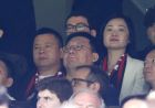 The new owner of AC Milan Li Yonghong, left, attends the Serie A soccer match between Inter Milan and AC Milan at the San Siro stadium in Milan, Italy, Saturday, April 15, 2017. (AP Photo/Antonio Calanni)