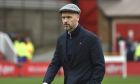 Manchester United's head coach Erik ten Hag walks on the pitch ahead the English Premier League soccer match between Nottingham Forest and Manchester United at City ground in Nottingham, England, Sunday, April 16, 2023. (AP Photo/Rui Vieira)