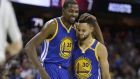 Golden State Warriors' Kevin Durant (35) hugs teammate Stephen Curry (30) during the first half of Game 4 of basketball's NBA Finals against the Cleveland Cavaliers in Cleveland, Friday, June 9, 2017. (AP Photo/Tony Dejak)