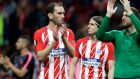 Atletico goalkeeper Jan Oblak, right, and Diego Godin, right, celebrate at the end of the Europa League semifinal, second leg soccer match between Atletico Madrid and Arsenal at the Metropolitano stadium in Madrid, Spain, Thursday, May 3, 2018. (AP Photo/Francisco Seco)