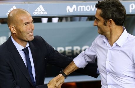 Real Madrid's head coach Zinedine Zidane, left, and FC Barcelona's head coach Ernesto Valverde shake hands prior to the Spanish Supercup, first leg, soccer match between FC Barcelona and Real Madrid at the Camp Nou stadium in Barcelona, Spain, Sunday, Aug. 13, 2017. (AP Photo/Manu Fernandez)