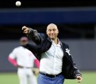 Retired New York Yankees shortstop Derek Jeter throws out the ceremonial first pitch after a pregame ceremony retiring his number 2 in Monument Park at Yankee Stadium in New York, Sunday, May 14, 2017. (AP Photo/Kathy Willens, Pool)