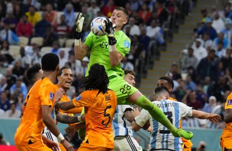 goalkeeper Andries Noppert of the Netherlands makes a save during the World Cup quarterfinal soccer match between the Netherlands and Argentina, at the Lusail Stadium in Lusail, Qatar, Saturday, Dec. 10, 2022. (AP Photo/Natacha Pisarenko)