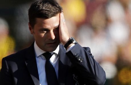 Tottenham manager Mauricio Pochettino reacts after Watford scored their first goal during the English Premier League soccer match between Watford FC and Tottenham Hotspur at Vicarage Road stadium in Watford, England, Sunday, Sept 2, 2018. (AP Photo/Frank Augstein)