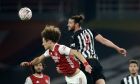 Newcastle's Andy Carroll, center right, jumps for the ball with Arsenal's David Luiz, center left, during the English FA Cup third round soccer match between Arsenal and Newcastle United at the Emirates Stadium in London, England, Saturday, Jan. 9, 2020. (AP Photo/Matt Dunham)