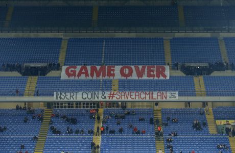 AC Milan's supporters show banners before the Italian Serie A soccer match against Cagliari at the San Siro stadium in Milan March 21, 2015. REUTERS/Alessandro Garofalo
 - RTR4UBG3