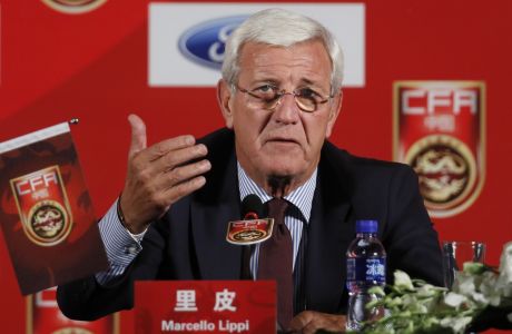 China's newly appointed national football team coach Marcello Lippi speaks during a news conference at a hotel in Beijing, Friday, Oct. 28, 2016. Lippi has urged his China team and the nation to pull together to accomplish the "improbable" task of qualifying for the 2018 World Cup before he begins a thorough overhaul of the struggling football program. (AP Photo/Andy Wong)