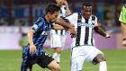 Fc Inter's defender Yuto Nagatomo challenges for the ball with  Udinese's defender Ednilson during the Italian serie A soccer match between Fc Inter and Udinese at Giuseppe Meazza stadium in Milan, 23  April 2016. 
ANSA / MATTEO BAZZI