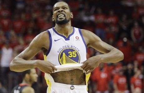 Golden State Warriors forward Kevin Durant (35) reacts as the Warriors defeat Houston Rockets in Game 7 of the NBA basketball Western Conference finals, Monday, May 28, 2018, in Houston. (AP Photo/David J. Phillip)