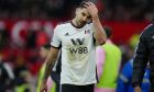 Fulham's Aleksandar Mitrovic reacts after he was shown a red card during the English FA Cup quarterfinal soccer match between Manchester United and Fulham at the Old Trafford stadium in Manchester, England, Sunday, March 19, 2023. (AP Photo/Jon Super)