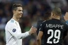 Real Madrid's Cristiano Ronaldo, left, congratulates PSG's Kylian Mbappe at the end of the Champions League Round of 16 first leg soccer match between Real Madrid and Paris Saint Germain at the Santiago Bernabeu stadium in Madrid, Spain, Wednesday, Feb. 14, 2018. Real Madrid defeated PSG 3-1.(AP Photo/Francisco Seco)