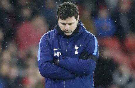 Tottenham manager Mauricio Pochettino walks on the sidelines during the English Premier League soccer match between Southampton and Tottenham Hotspur at the St Mary's Stadium in Southampton, England, Sunday, Jan. 21, 2008.(AP Photo/Frank Augstein)