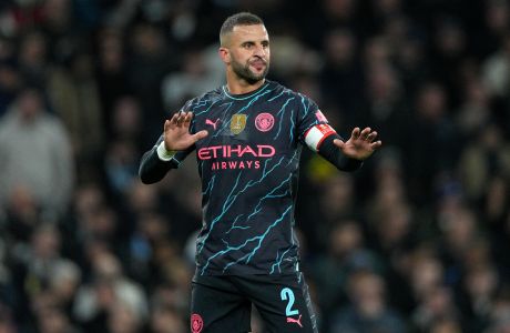 Manchester City's Kyle Walker gestures during the English FA Cup fourth round soccer match between Tottenham Hotspur and Manchester City in London, Friday, Jan. 26, 2024. (AP Photo/Dave Shopland)