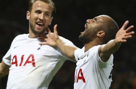 Tottenham Hotspur's Lucas Moura celebrates with Harry Kane scoring his side's third goal during the English Premier League soccer match between Manchester United and Tottenham Hotspur at Old Trafford stadium in Manchester, England, Monday, Aug. 27, 2018. (AP Photo/Dave Thompson)