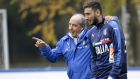 Italian soccer team coach Giampiero Ventura, left, hugs goalkeeper Gianluigi Donnarumma during a training session in Milan, Italy, Monday, Nov. 14, 2016 ahead of the friendly soccer match between Italy and Germany scheduled for Tuesday, Nov. 15, 2016. (AP Photo/ Luca Bruno)