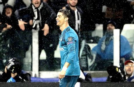 Real Madrid's Cristiano Ronaldo reacts after scoring the opening goal of his team during the Champions League, round of 8, first-leg soccer match between Juventus and Real Madrid at the Allianz stadium in Turin, Italy, Tuesday, April 3, 2018. (AP Photo/Luca Bruno)