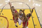 Golden State Warriors guard Stephen Curry, center, shoots between Houston Rockets guard Gerald Green, left, and guard Eric Gordon during the first half of Game 3 of the NBA basketball Western Conference Finals Sunday, May 20, 2018, in Oakland, Calif. (Kyle Terada/Pool Photo via AP)