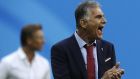 Iran head coach Carlos Queiroz, right, and Morocco coach Herve Renard, left, look at the players during the group B match between Morocco and Iran at the 2018 soccer World Cup in the St. Petersburg Stadium in St. Petersburg, Russia, Friday, June 15, 2018. (AP Photo/Themba Hadebe)