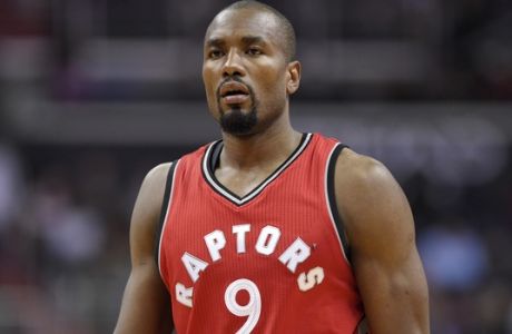 Toronto Raptors forward Serge Ibaka (9), of Congo, looks on during the first half of an NBA basketball game against the Washington Wizards, Friday, March 3, 2017, in Washington. (AP Photo/Nick Wass)