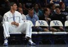 FILE - In this Oct. 15, 2010 file photo, Kentucky basketball freshman Enes Kanter, left, watches the basketball scrimmage from the sidelines during NCAA college basketball Big Blue Madness at Rupp Arena in Lexington, Ky. (AP Photo/James Crisp, File)