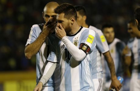 Argentina's Javier Mascherano, left, talks with Argentina's Lionel Messi as they leave the pitch on halftime during their 2018 World Cup qualifying soccer match against Ecuador at the Atahualpa Olympic Stadium in Quito, Ecuador, Tuesday, Oct. 10, 2017. (AP Photo/Fernando Vergara)