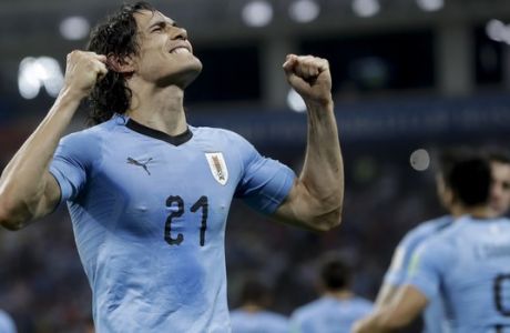 Uruguay's Edinson Cavani celebrates after scoring his side's 2nd goal during the round of 16 match between Uruguay and Portugal at the 2018 soccer World Cup at the Fisht Stadium in Sochi, Russia, Saturday, June 30, 2018. (AP Photo/Andre Penner)