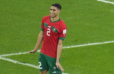 Morocco's Achraf Hakimi celebrates after he scored the decisive penalty at the end of the World Cup round of 16 soccer match between Morocco and Spain, at the Education City Stadium in Al Rayyan, Qatar, Tuesday, Dec. 6, 2022. (AP Photo/Ricardo Mazalan)